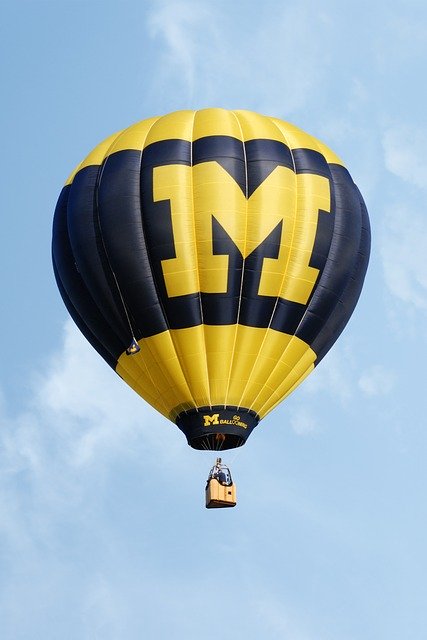 A hot air balloon in U of M's signature corn and blue colors, with the university's large M emblazoned on the side.